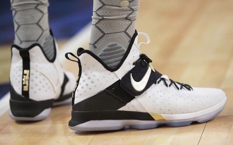 LeBron James in the Nike LeBron 14 “White with black strap”